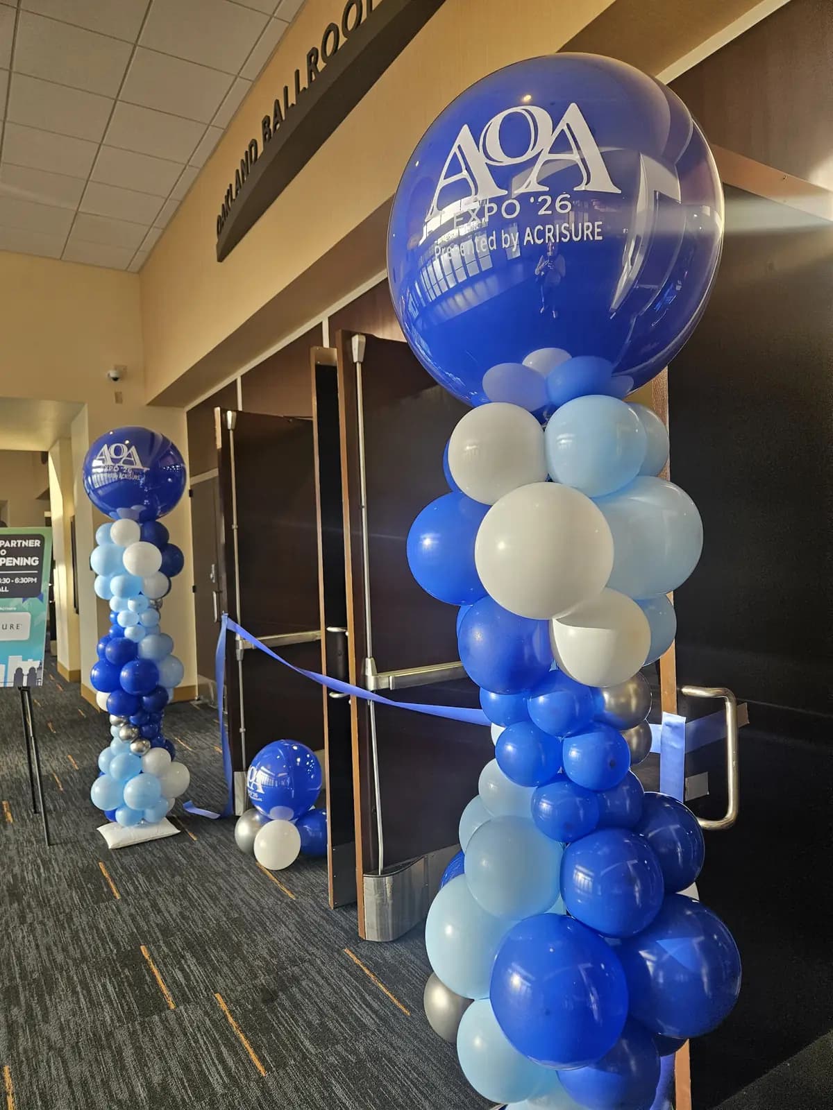 AOA Expo 2026 Acrisure Balloon Columns Marriott Oakland — view 01