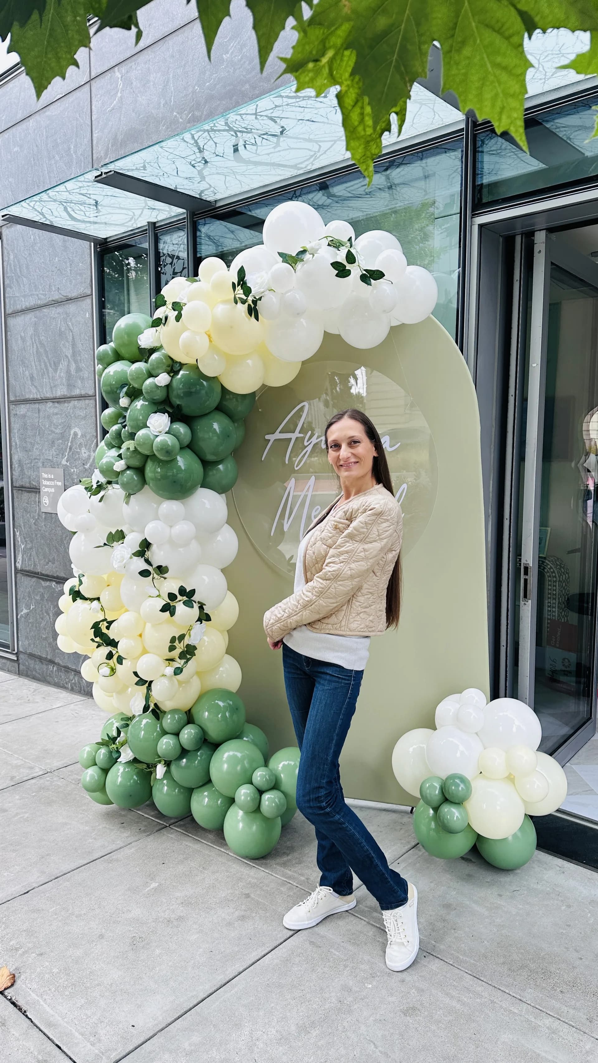 Salon Grand Opening in San Francisco, California: organic balloon arch and branded backdrop, view 8 of 8.