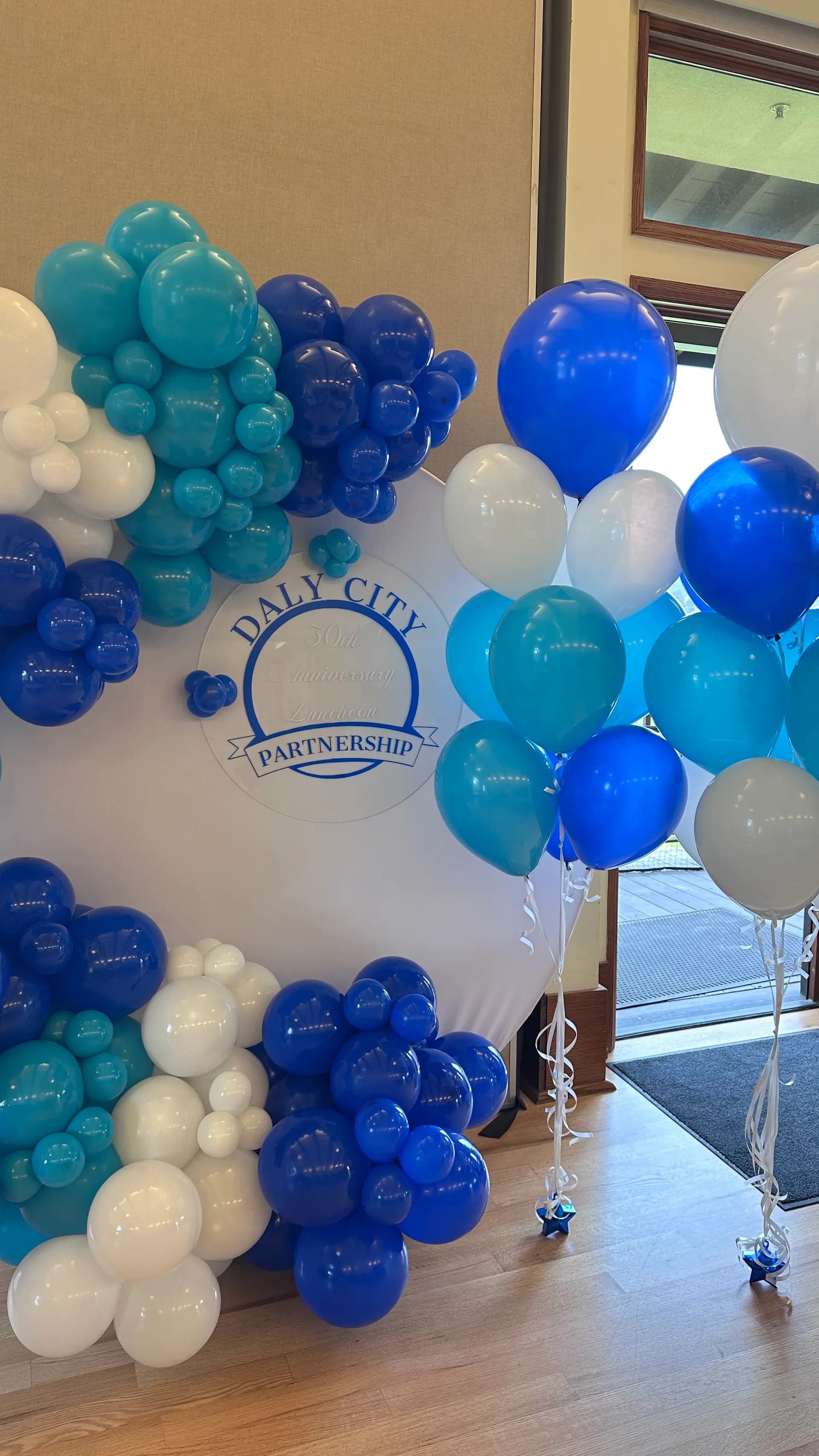 Balloon backdrop and helium bouquets for Daly City Partnership at the 50th Anniversary Luncheon in Daly City, California.