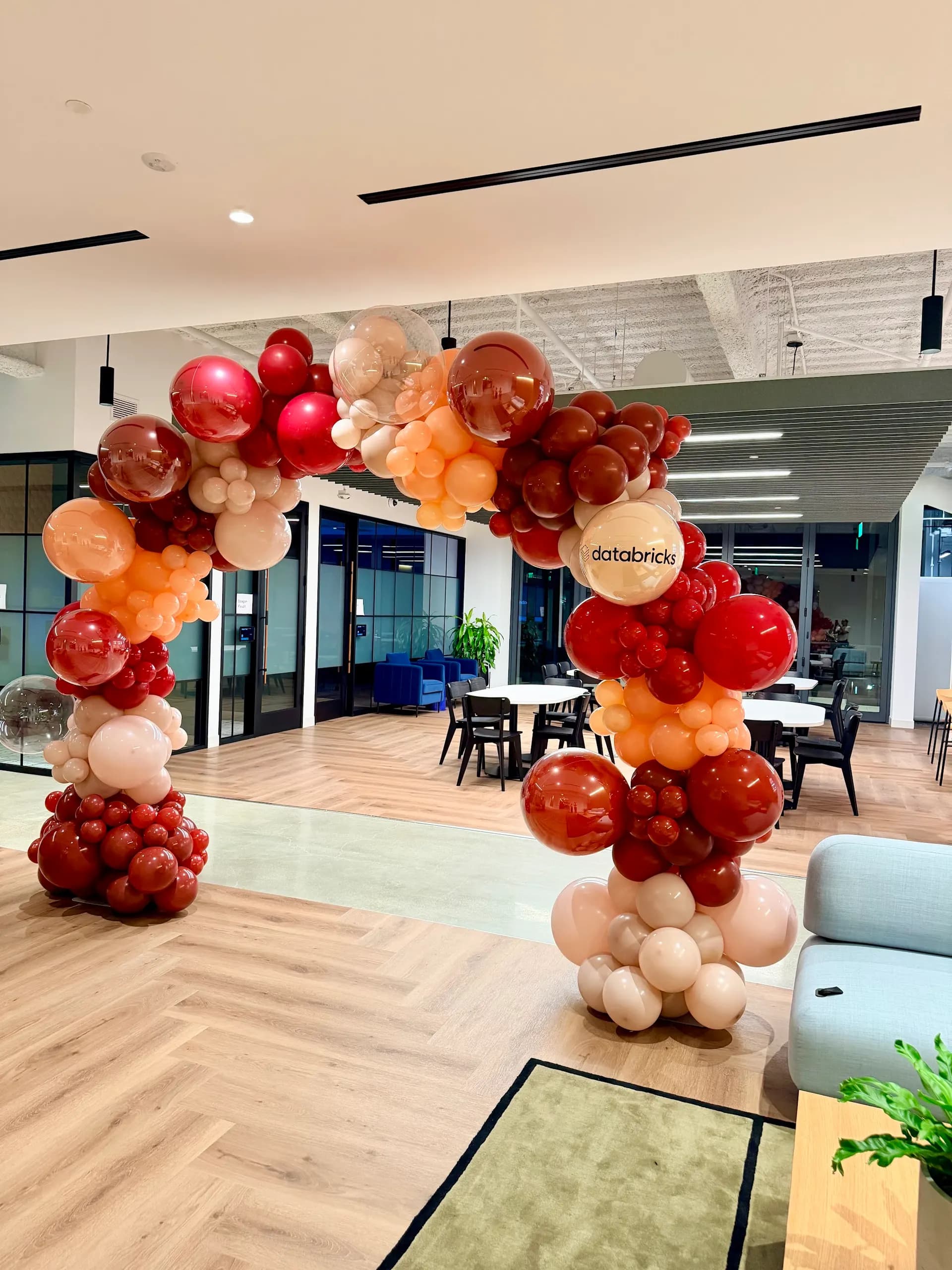 Corporate event décor by Balloon Décor: organic balloon arch in burgundy, peach, cream and clear, Silicon Valley, California — view 6.