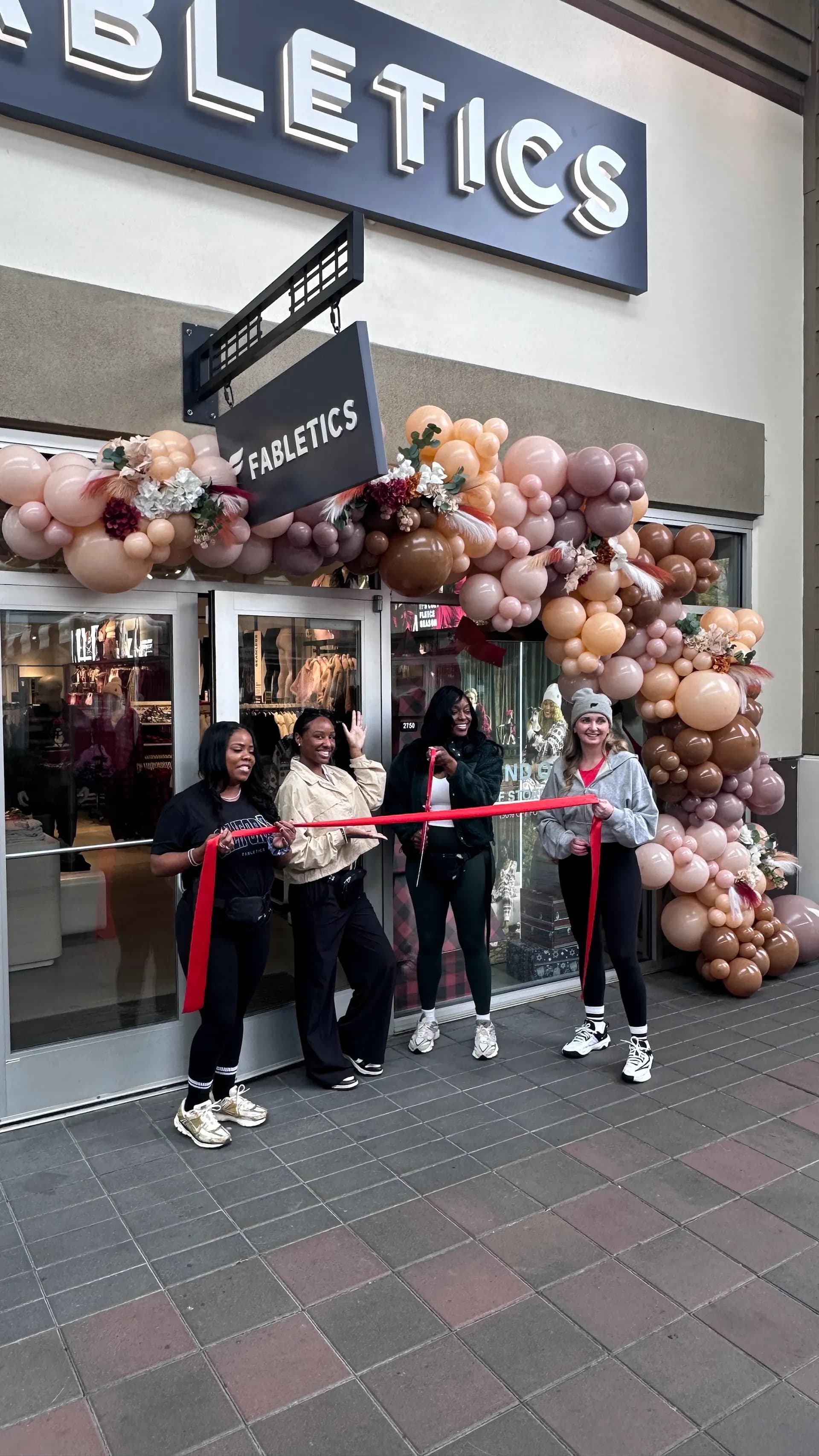 Branded storefront balloon arch for Fabletics at the Store Grand Opening in San Francisco Bay Area.