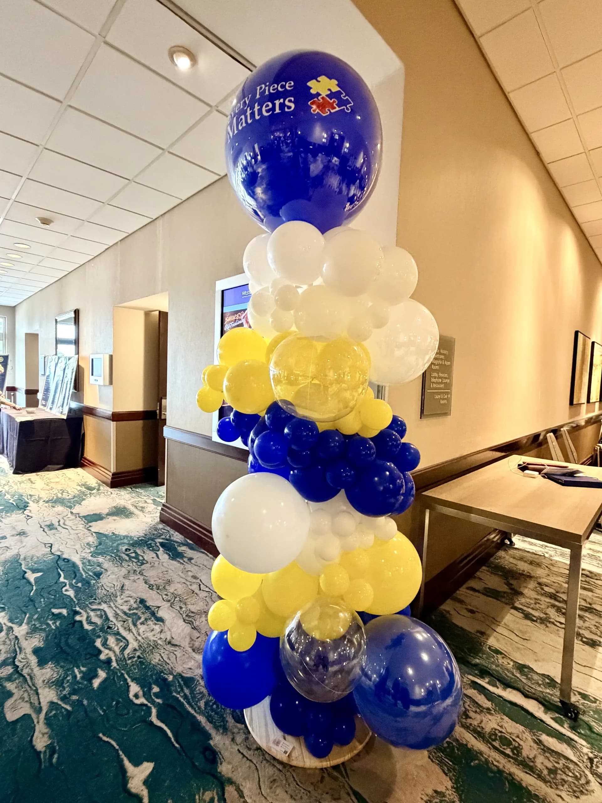Branded balloon columns and helium bouquets produced by Balloon Décor for Foster City Rotary Club in Foster City, California, view 3.