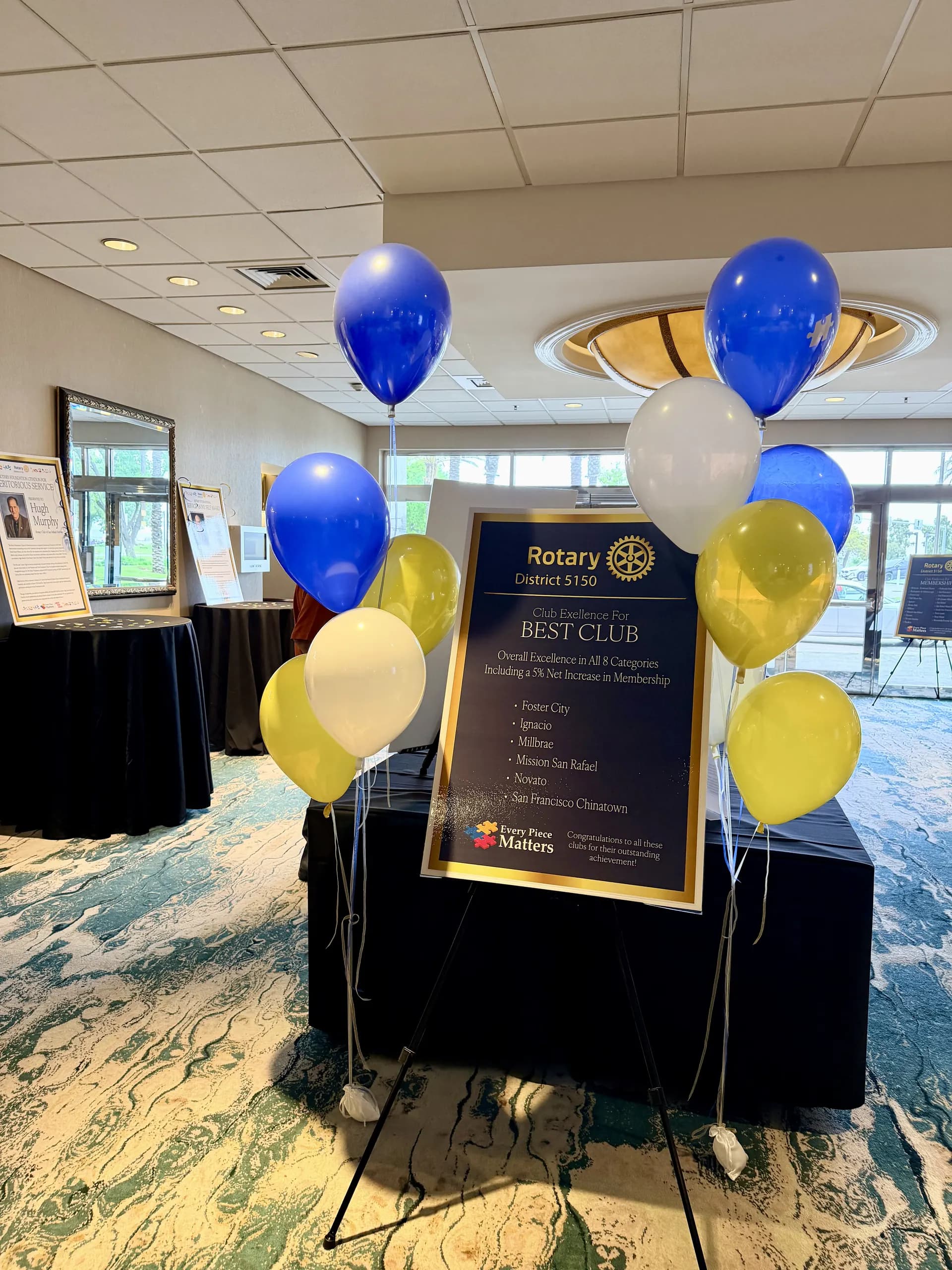 Branded balloon columns and helium bouquets installed on site for the Annual Meeting in Foster City, California, frame 5 of 7.