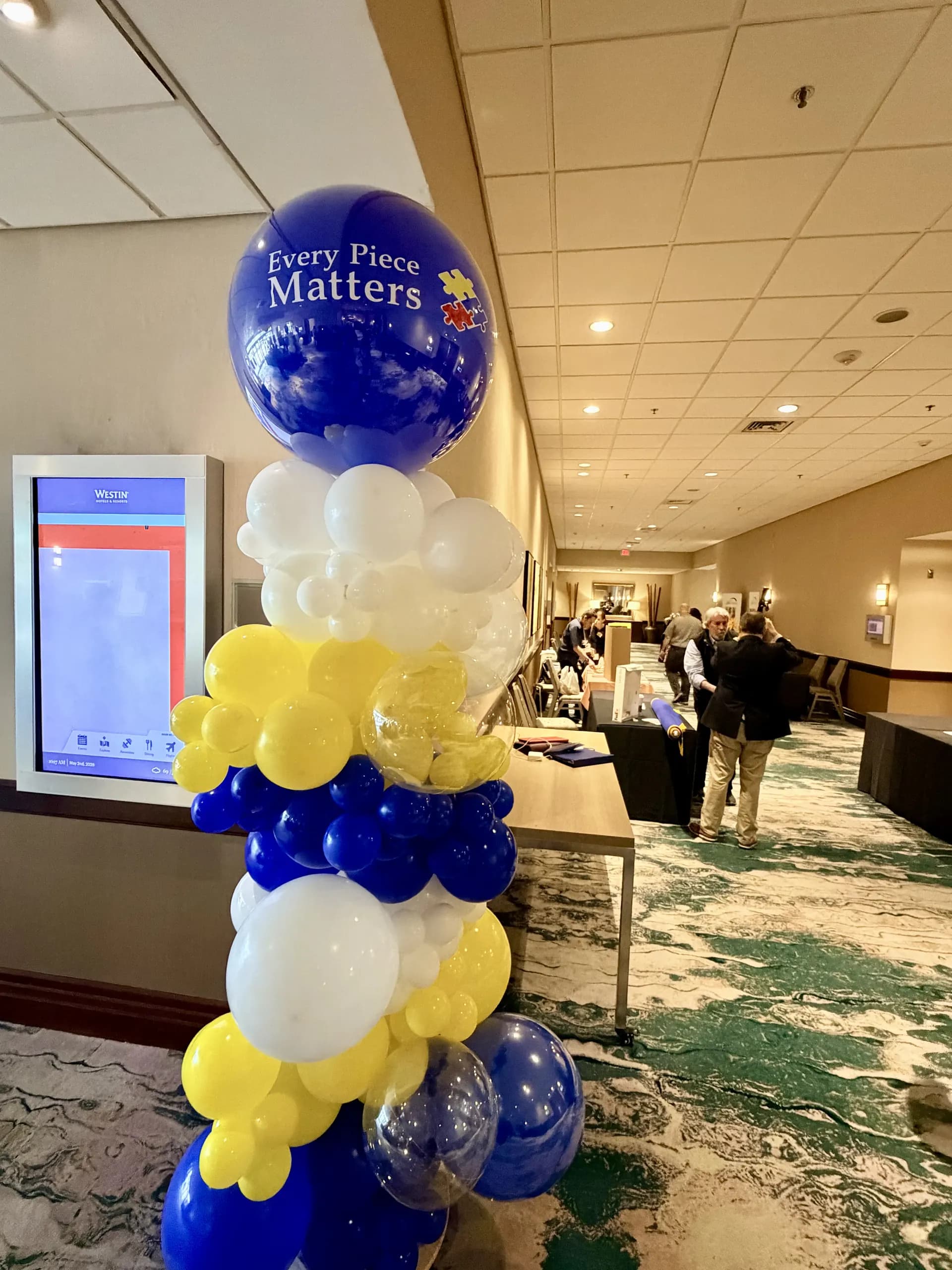 Branded balloon columns and helium bouquets in rotary blue, yellow, white and clear, Annual Meeting, Foster City, California — view 7 of 7.