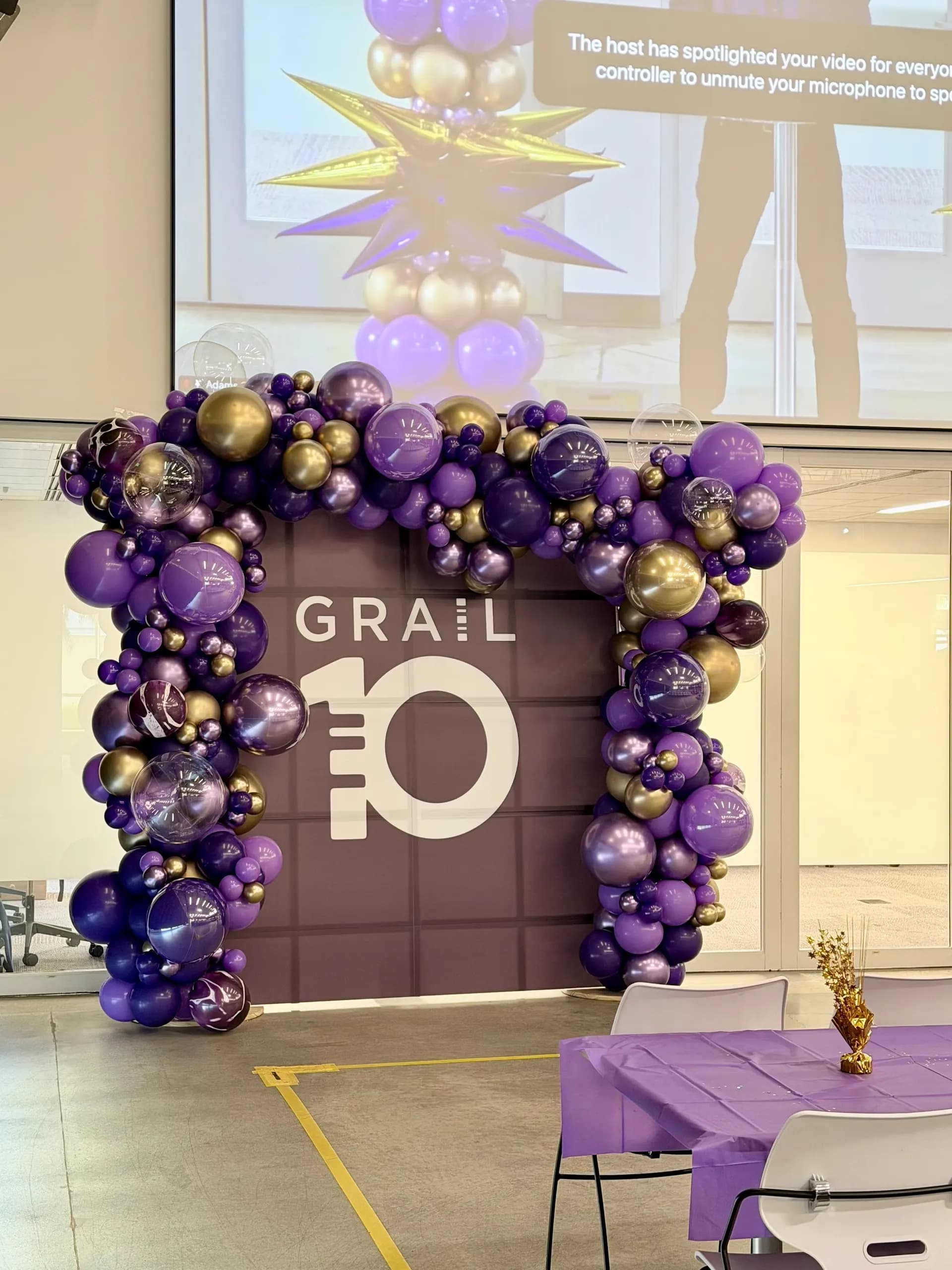 GRAIL's 10-Year Anniversary Celebration in San Francisco Bay Area: branded balloon arch, backdrop and starburst columns, view 2 of 4.