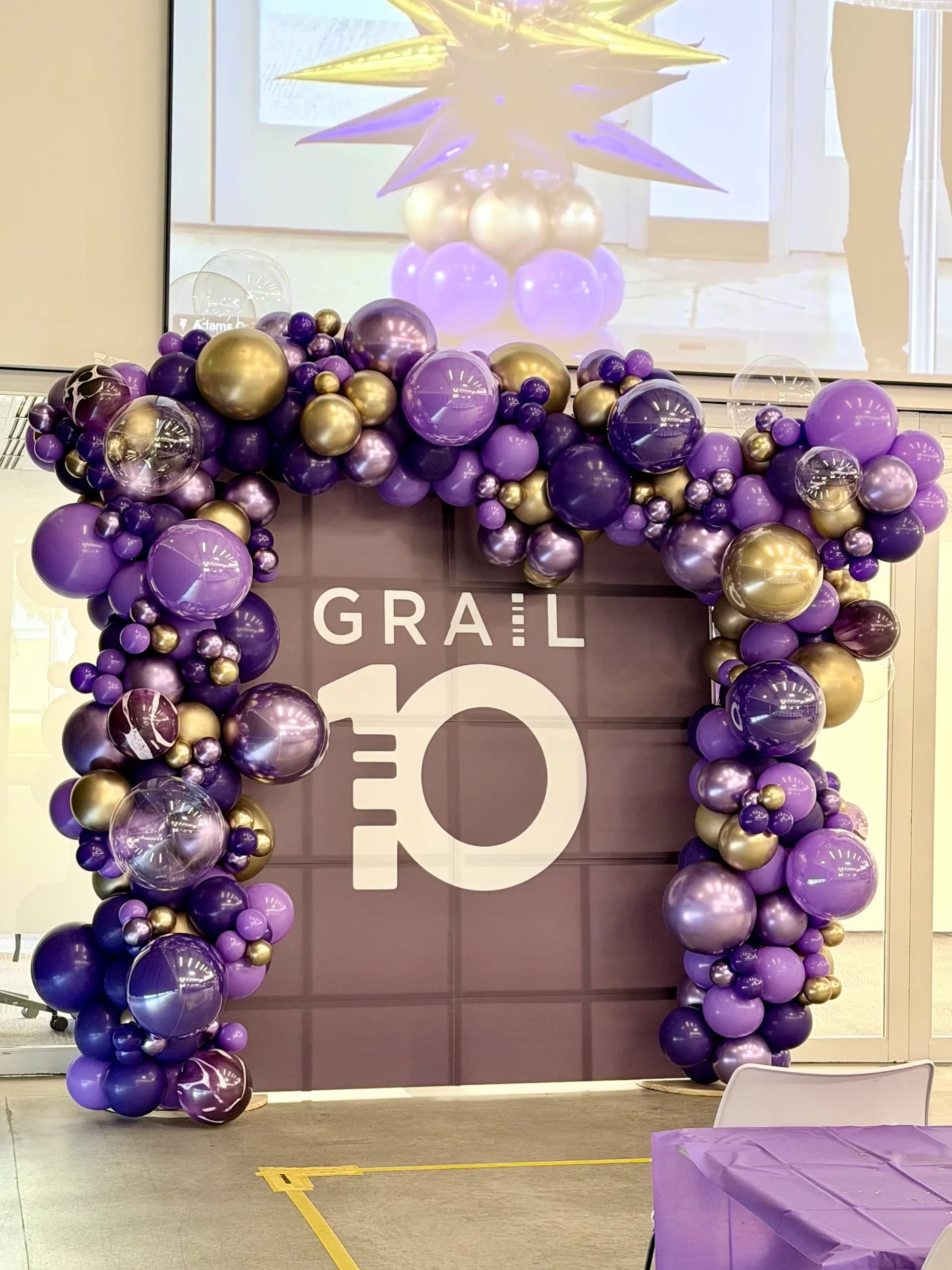 Completed branded balloon arch, backdrop and starburst columns from the 10-Year Anniversary Celebration project in San Francisco Bay Area (image 4 of 4).