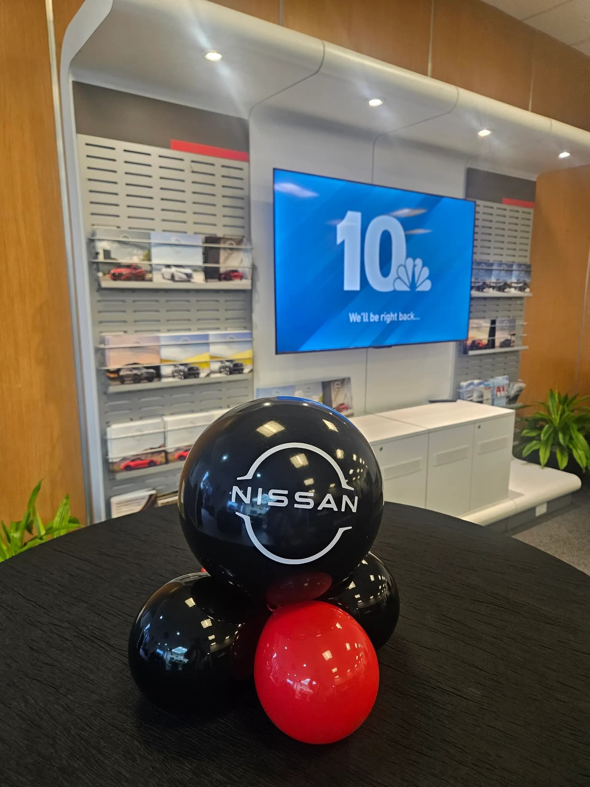 Nissan's Dealership Grand Opening in San Francisco Bay Area: showroom décor and branded centerpieces, view 2 of 3.