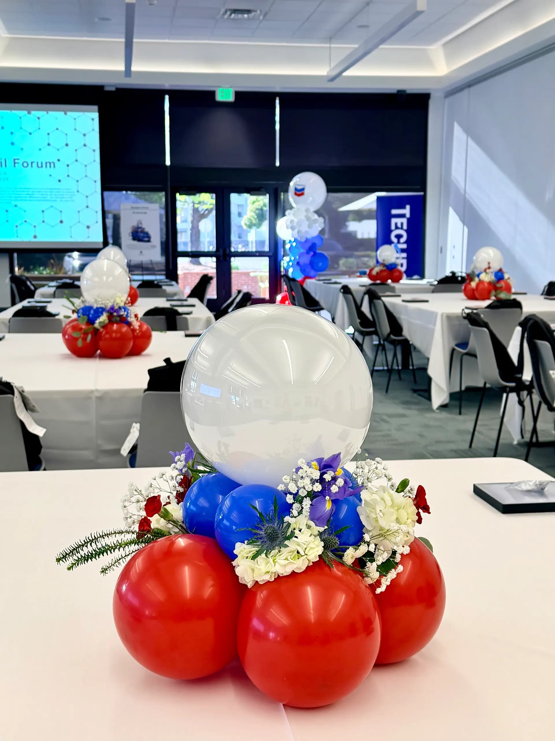 Balloon arch and floral balloon centerpieces produced by Balloon Décor for NorCal Retail Forum in Richmond, California, view 3.