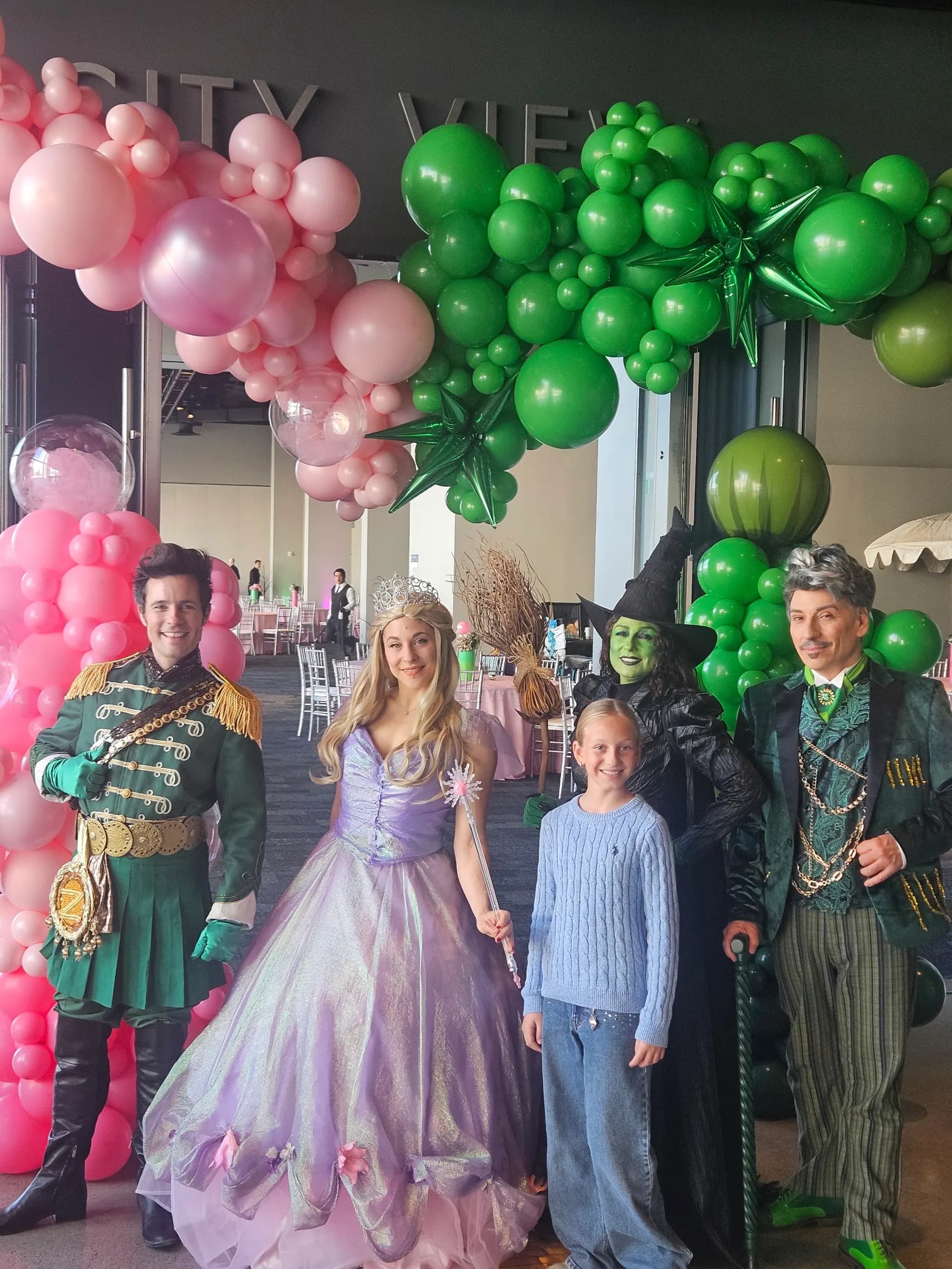 Emerald City and Glinda themed arches and centerpieces in emerald green and pink, Themed Corporate Event, San Francisco, California — view 7 of 8.