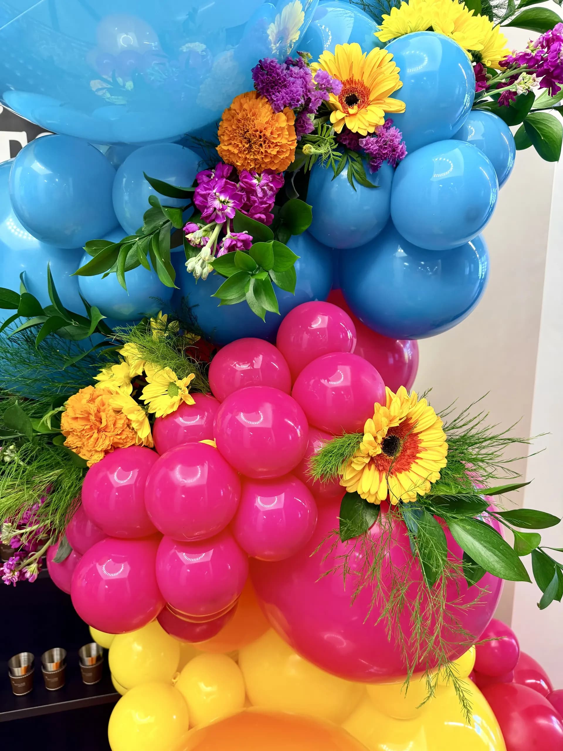 Balloon photo zone with fresh flowers and centerpieces produced by Balloon Décor for Skyline Construction in San Jose, California, view 3.