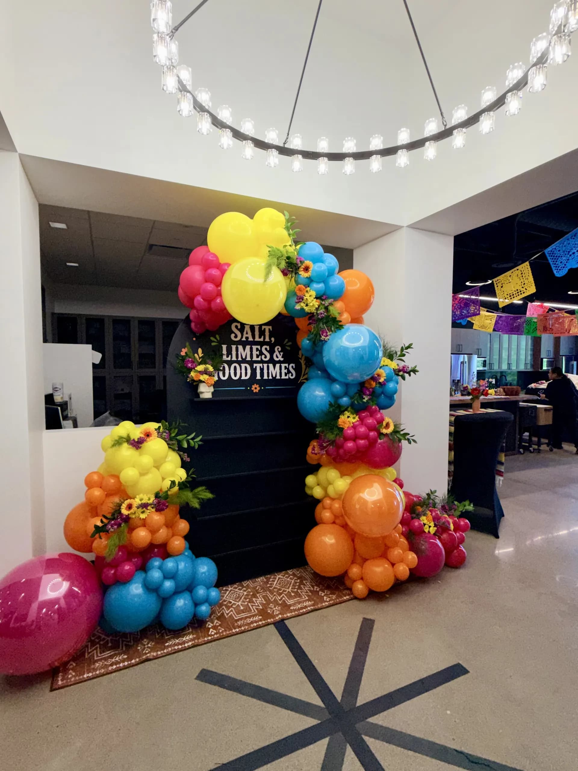 Skyline Construction's Office Celebration in San Jose, California: balloon photo zone with fresh flowers and centerpieces, view 8 of 8.