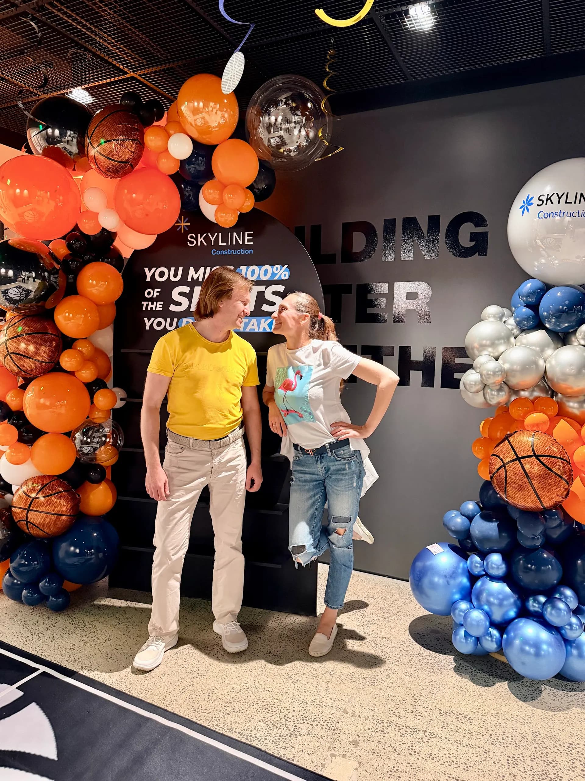 Corporate event décor by Balloon Décor: basketball-themed garland and branded columns in orange, black, navy and silver, San Francisco Bay Area — view 6.