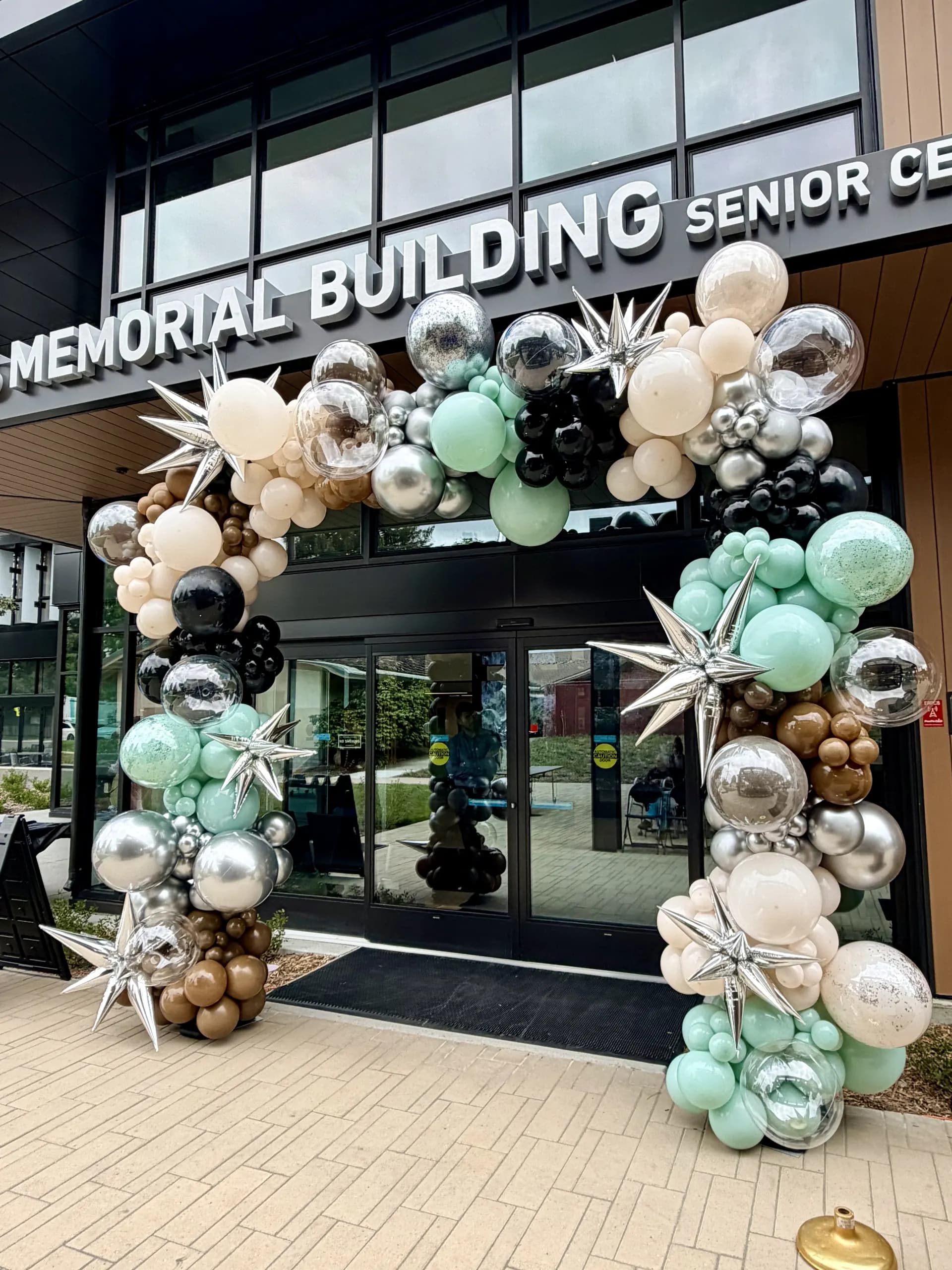 Redwood City Veterans Memorial Senior Center's Grand Opening in Redwood City, California: large-scale entrance balloon arch and interior balloon installation, view 2 of 8.