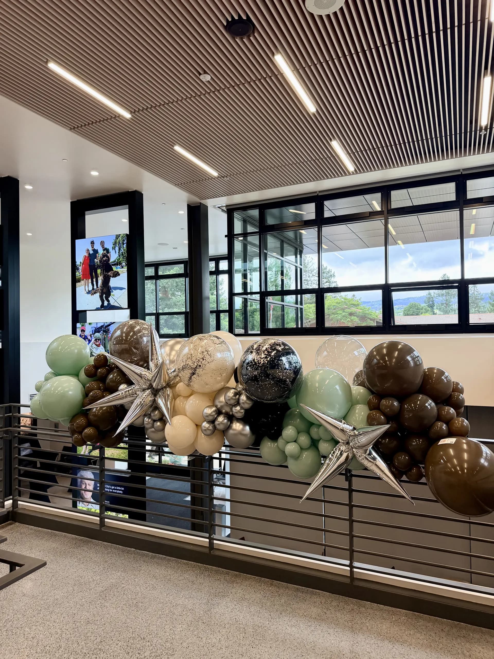 Completed large-scale entrance balloon arch and interior balloon installation from the Grand Opening project in Redwood City, California (image 4 of 8).